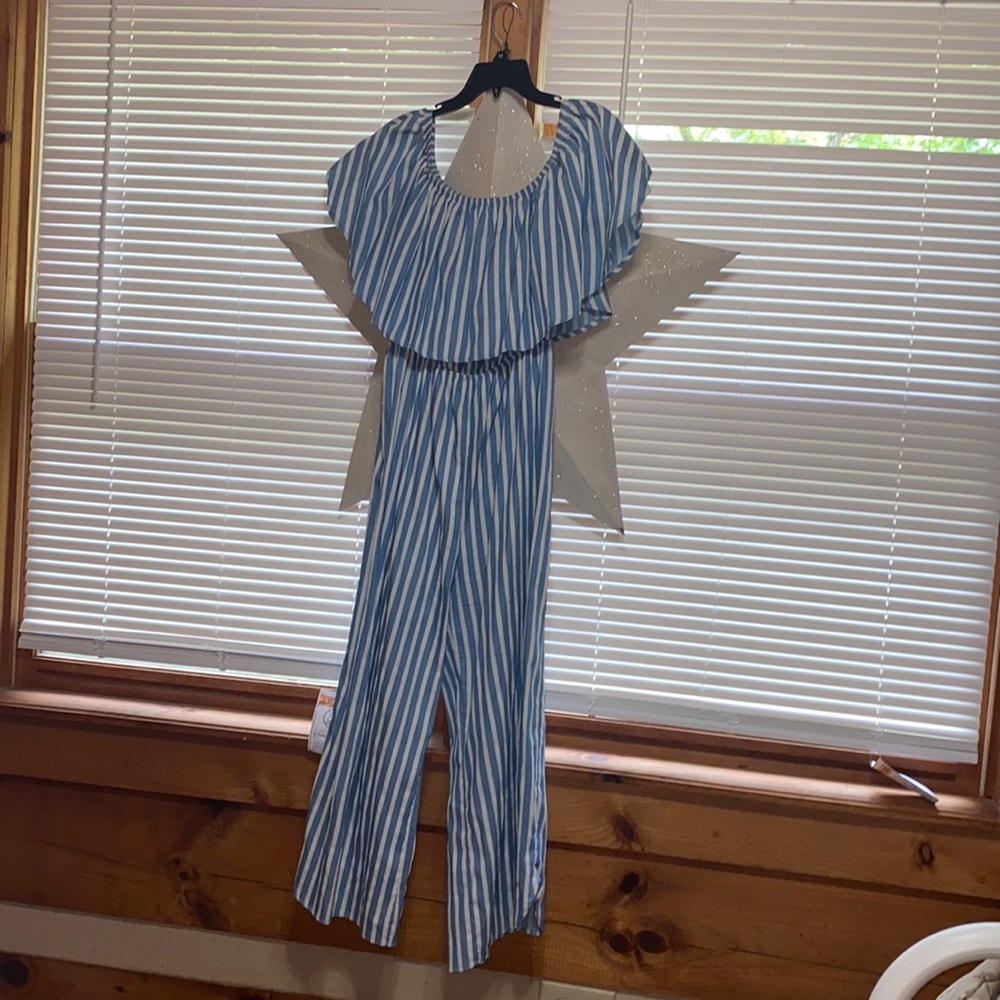 American Thread’s off the shoulder striped jump suit.